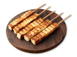 Grilled Rennet or Coalho cheese on a wooden board isolated over white background