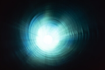 Dark tunnel perspective with glowing end. Industrial photo
