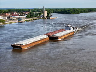 Aerial view of a Barge traveling up the Mississippi River