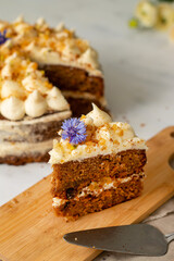 Vegan raw carrot cake on a white table. Healthy food. 