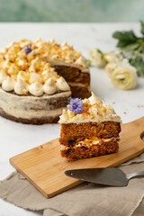 Vegan raw carrot cake on a white table. Healthy food. 
