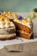 Vegan raw carrot cake on a white table. Healthy food. 