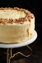 Walnut sponge cake with cream inside. Rustic background