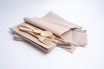 Kraft paper tableware: cups, food boxes, isolated on a light background. A set of various disposable tableware. Recycling and zero waste concept. Mock up