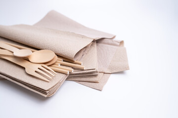 Kraft paper tableware: cups, food boxes, isolated on a light background. A set of various disposable tableware. Recycling and zero waste concept. Mock up
