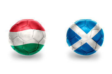 football balls with national flags of scotland and hungary ,soccer teams. on the white background.
