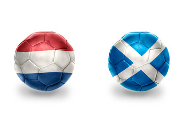 football balls with national flags of scotland and netherlands ,soccer teams. on the white...