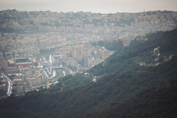 foggy Genova town, Italy, aerial view. Beautiful aerial view of Val Bisagno, Marassi district, Bisagno river and Stadio Luigi Ferraris football stadium, home of Genoa and Sampdoria football clubs