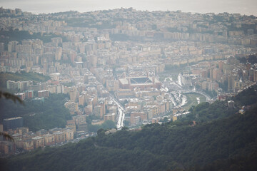 foggy Genova town, Italy, aerial view. Beautiful aerial view of Val Bisagno, Marassi district, Bisagno river and Stadio Luigi Ferraris football stadium, home of Genoa and Sampdoria football clubs