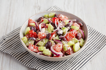 Homemade Chopped Mediterranean Salad in a Bowl, side view.