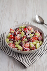 Homemade Chopped Mediterranean Salad in a Bowl, side view.