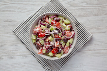 Homemade Chopped Mediterranean Salad in a Bowl, top view. Flat lay, overhead, from above.