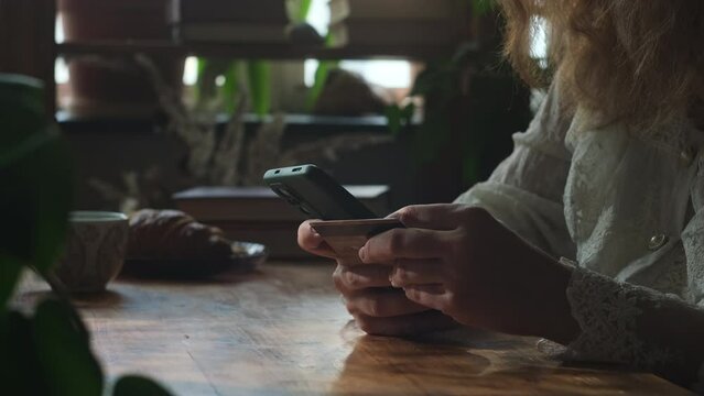 Person using bank card for internet shopping payments