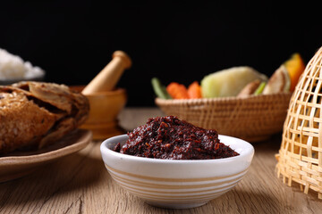 pork shrimp chilli dip local thai food sauce isolated in wood background