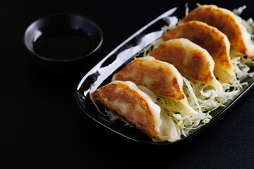Gyoza Japanese food dumpling isolated in black background