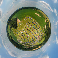 Panoramic view from drone, small planet and blue sky around the globe