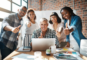 Thumbs up, laptop and portrait of business people in office for collaboration, about us and teamwork at startup. Creative, diversity and men and women with gesture for success, winning and agreement