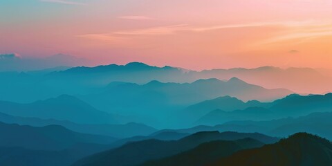 Obraz premium A serene and picturesque view of a mountain range at sunset