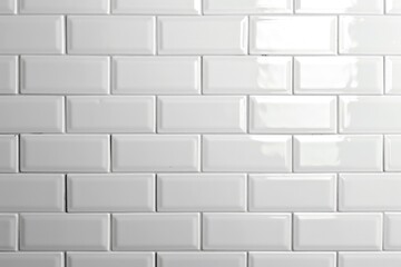 Fototapeta premium Close-up shot of a white tiled wall with slight texture and no other objects in frame