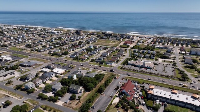Busy streets in Kill Devil Hills, NC outer banks showing ocean homes, beach front real estate day to day living by the ocean