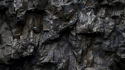 Dark and jagged rock formations with rough edges and a craggy appearance adding depth to the texture