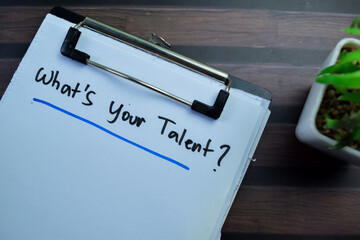 Concept of What's Your Talent? write on paperwork isolated on wooden background.