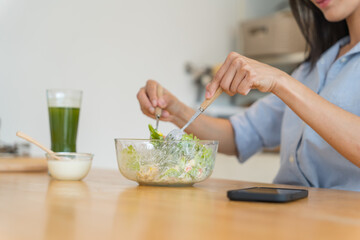 Asian woman dieting Weight loss eating fresh fresh homemade salad healthy eating concept