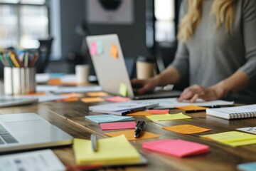 Creative designer engaging in project brainstorming with vibrant team in modern office