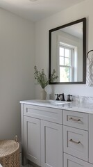 modern master bathroom adorned with an elegant black metal rectangular framed mirror, casting reflections against pristine white walls in a minimalist oasis of tranquility.