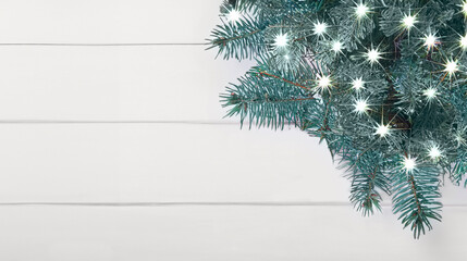 Christmas garland lights, holiday festive winter art design. Widescreen backdrop. Snowy scene.