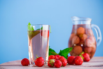 Sweet refreshing berry compote of ripe strawberries in a decanter