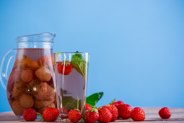 Sweet refreshing berry compote of ripe strawberries in a decanter