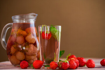 Sweet refreshing berry compote of ripe strawberries in a decanter