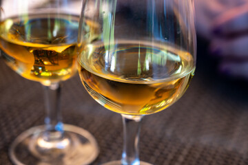 Tasting of Bordeaux white wine in Sauternes, left bank of Gironde Estuary, France. Glasses of white...