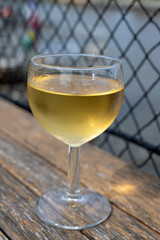 Tasting of Bordeaux white wine, right bank of Gironde Estuary, France. Glasses of white sweet French wine served in outdoor restaurant on oysters farm in Gujan-Mestras, Arcachon bay