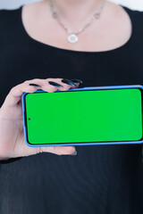 Woman's hands holding a large smartphone