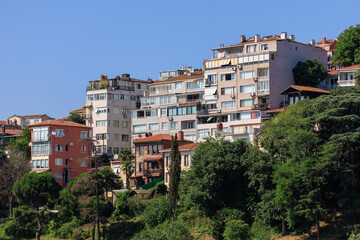 Southern cityscape, view of buildings and houses with green plants in public places in Turkey, sunny summer day in the city of Istanbul