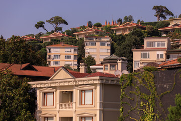 Southern cityscape, view of buildings and houses with green plants in public places in Turkey, sunny summer day in the city of Istanbul