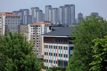 Southern cityscape, view of buildings and houses with green plants in public places in Turkey, sunny summer day in the city of Istanbul