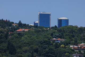 Fototapeta premium Cityscape, view of buildings and houses with green plants in public places in Turkey, sunny summer day in the city of Istanbul