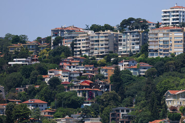 Fototapeta premium Cityscape, view of buildings and houses with green plants in public places in Turkey, sunny summer day in the city of Istanbul