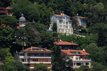 Cityscape, view of buildings and houses with green plants in public places in Turkey, sunny summer...