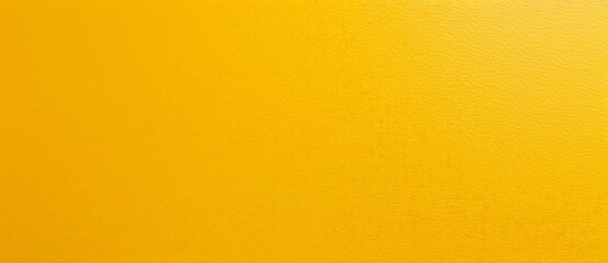 Fototapeta premium Bright yellow textured background is providing a clean and minimal look. This solid color background would be perfect for a variety of projects