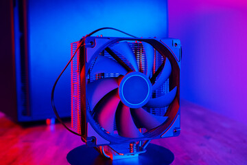 Air cooling system with fan close up. PC case on background in neon light with smoke. Rendering and...