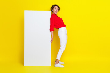 Full length photo of young attractive successful woman wear formal outfit hold paper banner advert...