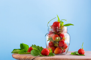 fresh sweet red strawberries in a glass jar