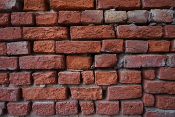 Obraz premium Abandoned rustic brick layered wall surface, Grungy red brick wall texture background, Old rustic colored wall backdrop