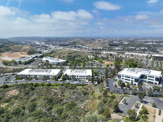 Aerial view of business park with mixed use facility service building and offices in South San...