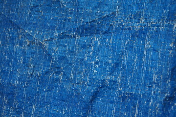 Blue grungy background with light shade, Rustic uneven material backdrop design, stripped particle...