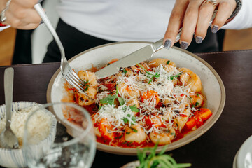 person eating pasta